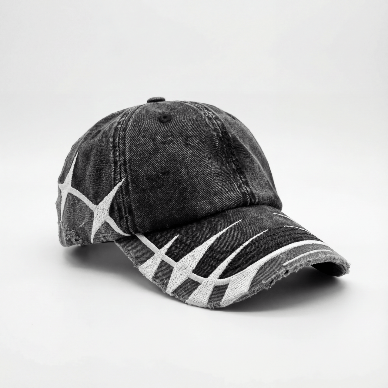 madebycrumble AVALIN two-tone black cap, angled view with brim distressing and embroidered separation line