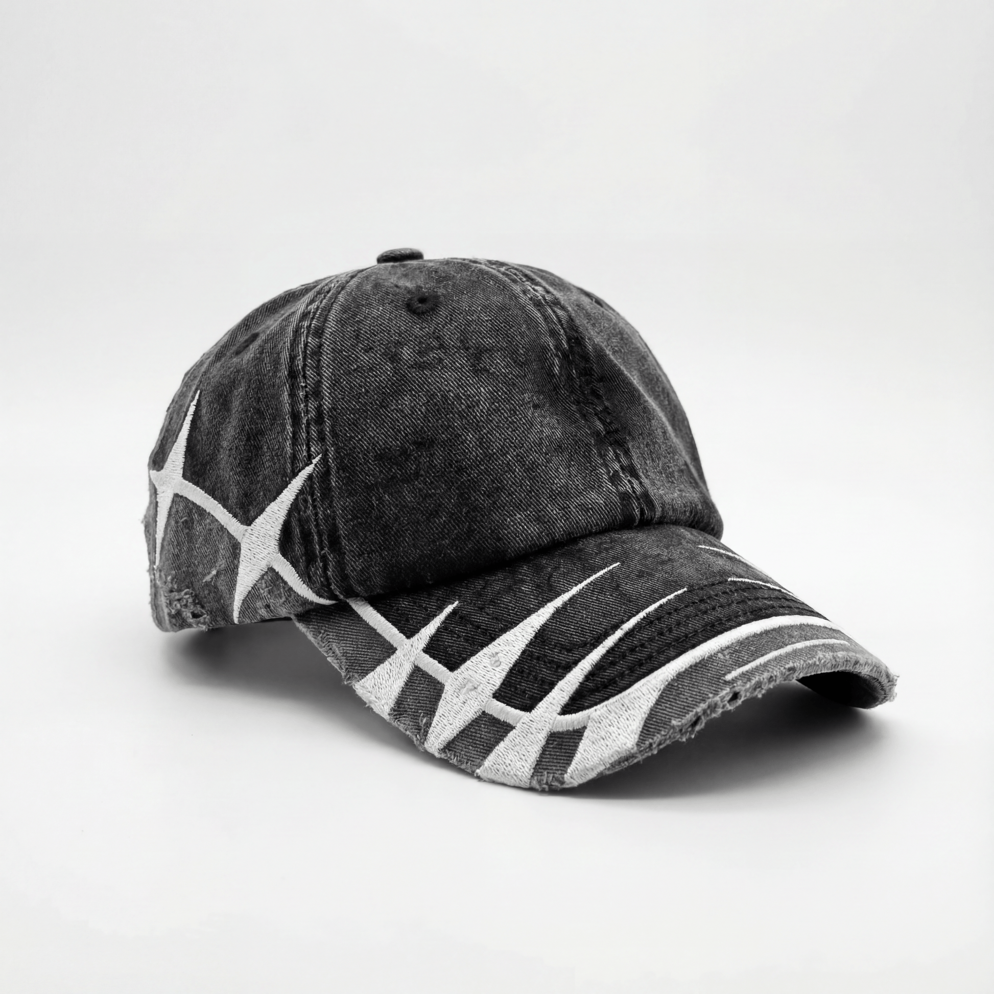 madebycrumble AVALIN two-tone black cap, angled view with brim distressing and embroidered separation line
