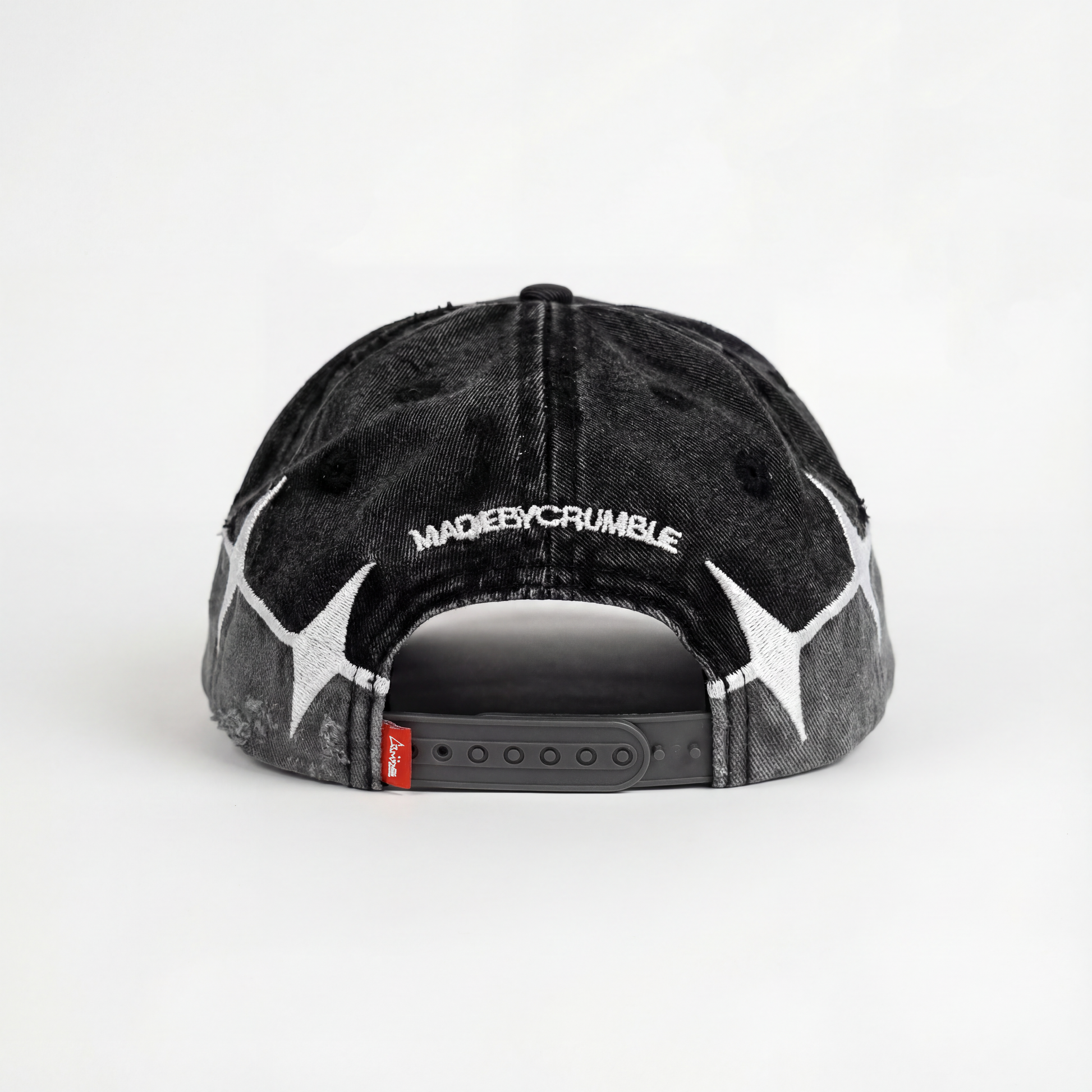 AVALIN two-tone black snapback by madebycrumble, rear embroidery and red woven Crumble tag