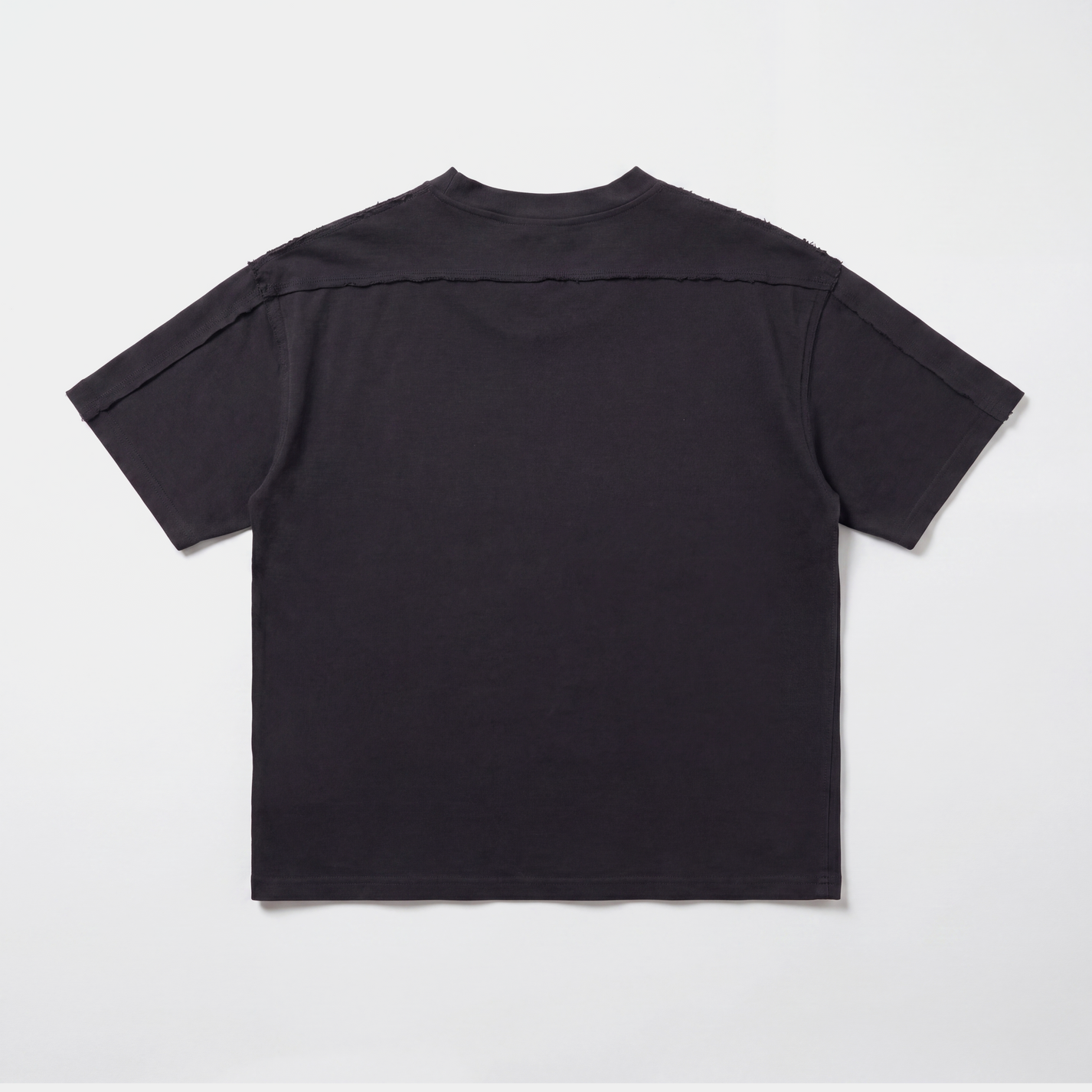 Black AVALIN tee, distressed detailing across shoulders and triceps, full back view. Heavyweight boxed fitted t-shirt.
